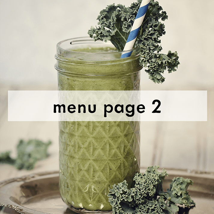 Chilled glass of creamy green kale strawberry banana smoothie with a striped blue straw on a tray with decorative kale. Overlay text reads "menu page two."